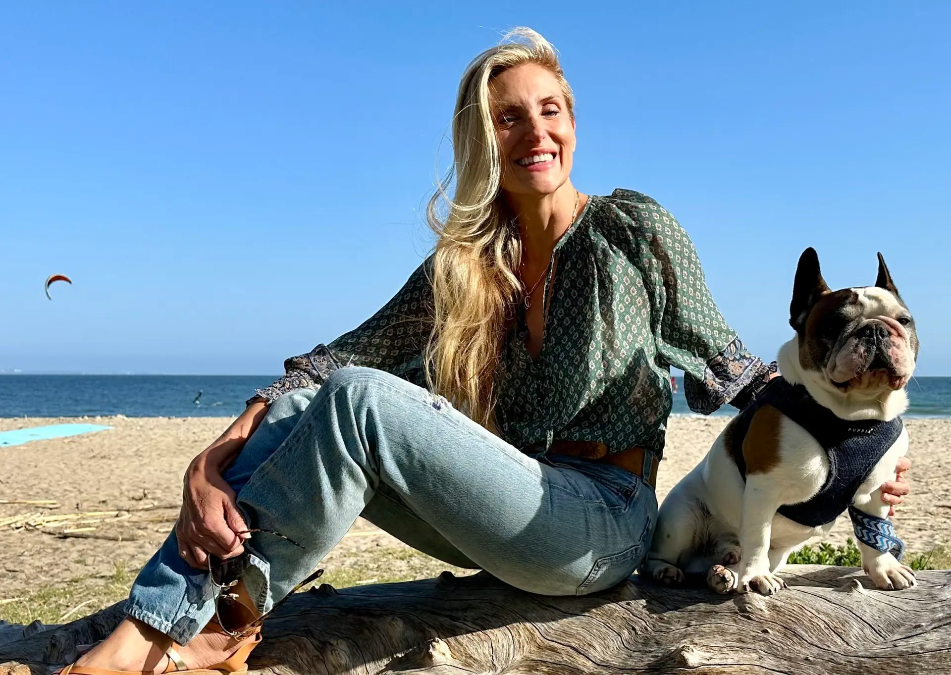 Elizabeth Hudson with dog on the beach